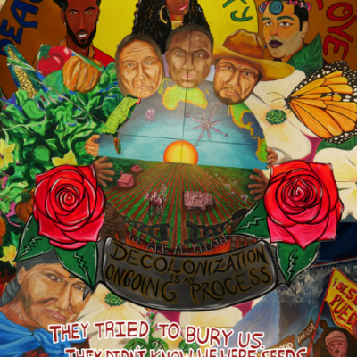colorful poster showing various faces and two red roses
